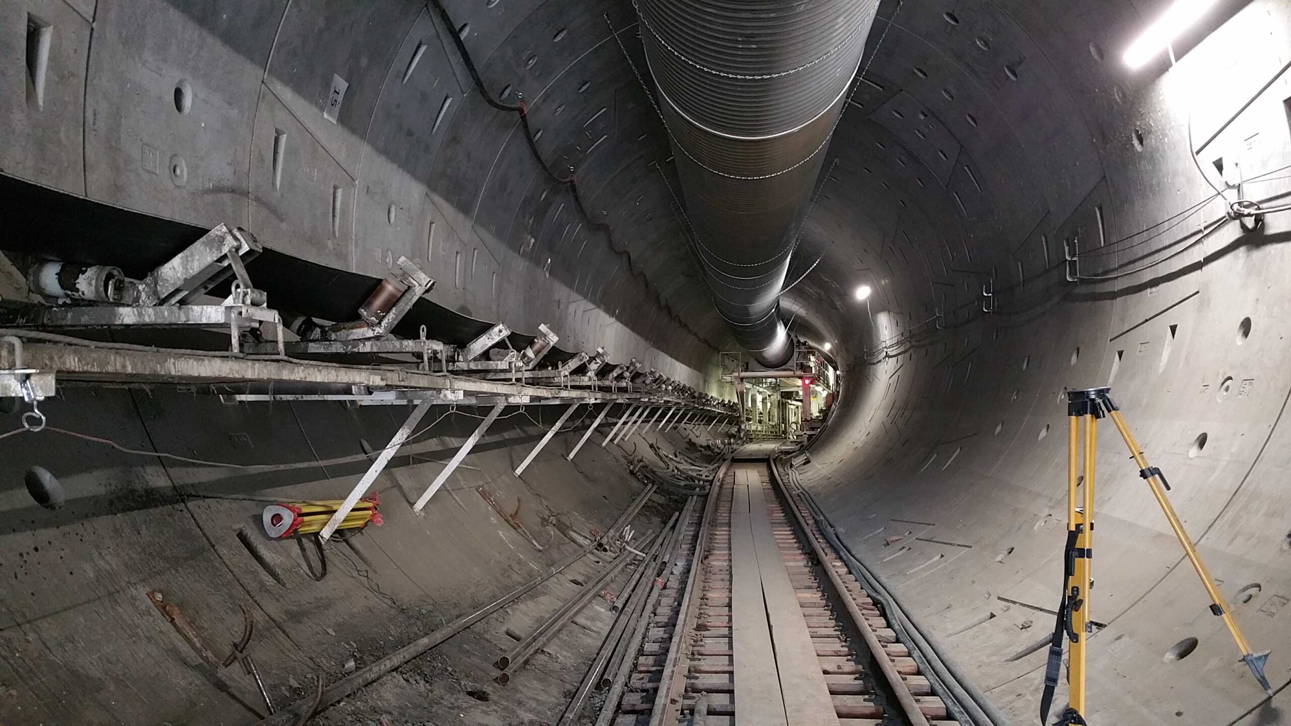 Pecast segmental tunnel lining with conveyor belt